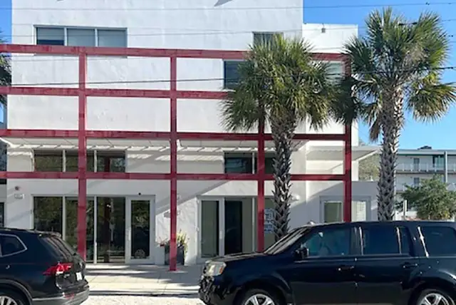 S&W Kitchens Sarasota showroom on 5th Street in the Rosemary Design District, with palm trees out front